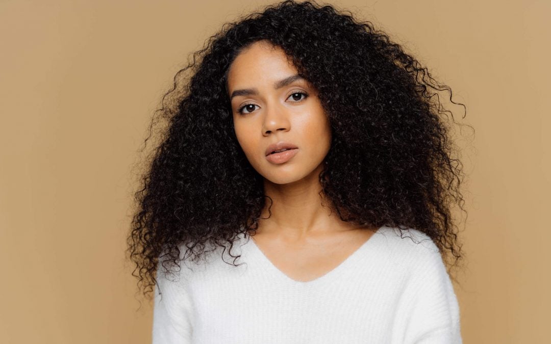 How To Tame Frizzy Hair: Tips And Tricks